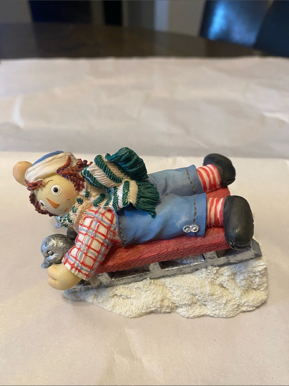 Holiday Sledding Figurine - Red, Blue & Green Decorative Accent